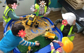 nursery children enjoying construction toya
